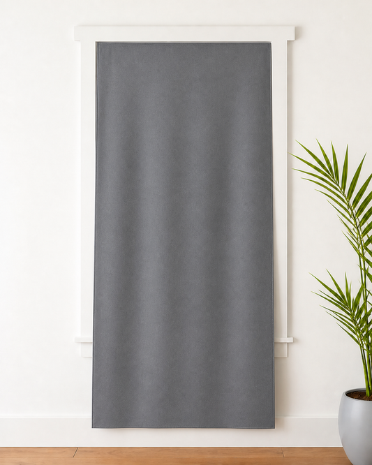 [Dawnproof V7.1 Anywhere 01] Soft Gray flexible blackout panel attached flat at the top and extending beyond the window glazing